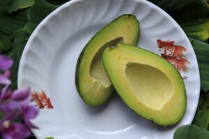 sliced avocado fruits on round white ceramic plate